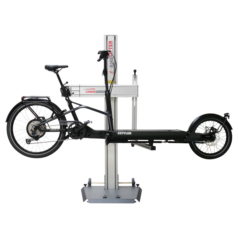 Die Cargo plus Clamp für e-Bikelifter ist die ideale Lösung für das sichere Heben von Bikes und Cargobikes bis zu 60 kg am e-Bikelifter BM-65. Hier dargestellt mit einem eingespannten Cargobike.